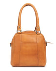 Suki leather purse by Dusky Robin with structured design and rolled handles in tan color.