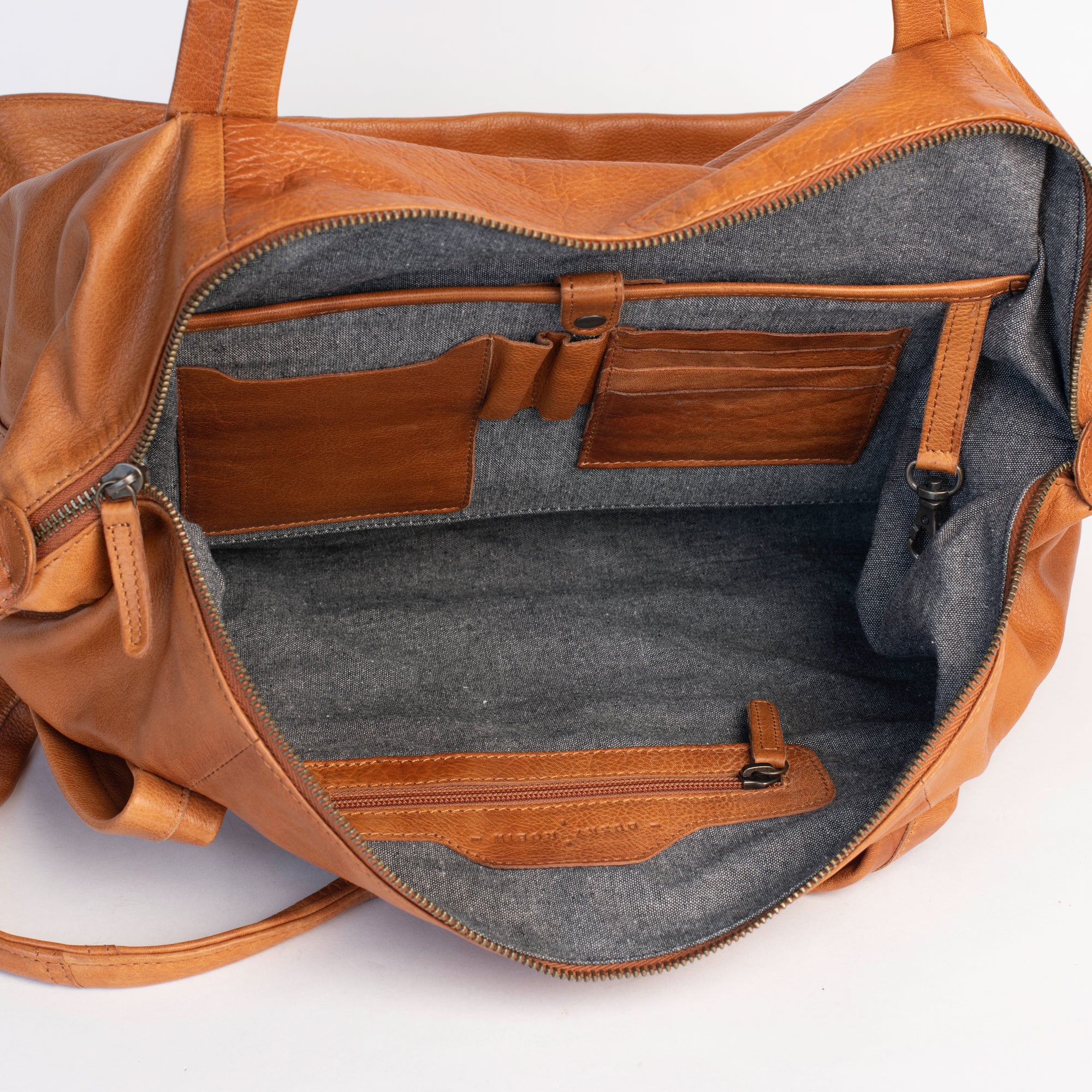 Interior view of the Hannah Overnight Bag showing leather purse compartments and organizer features.