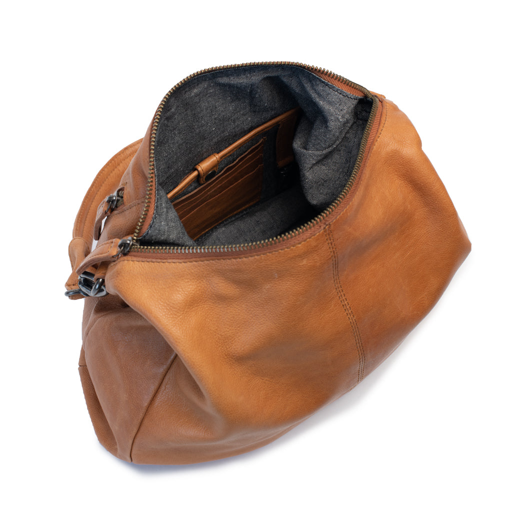 Interior view of the Poppy Bag showcasing its spacious design with dark grey lining and internal pockets.