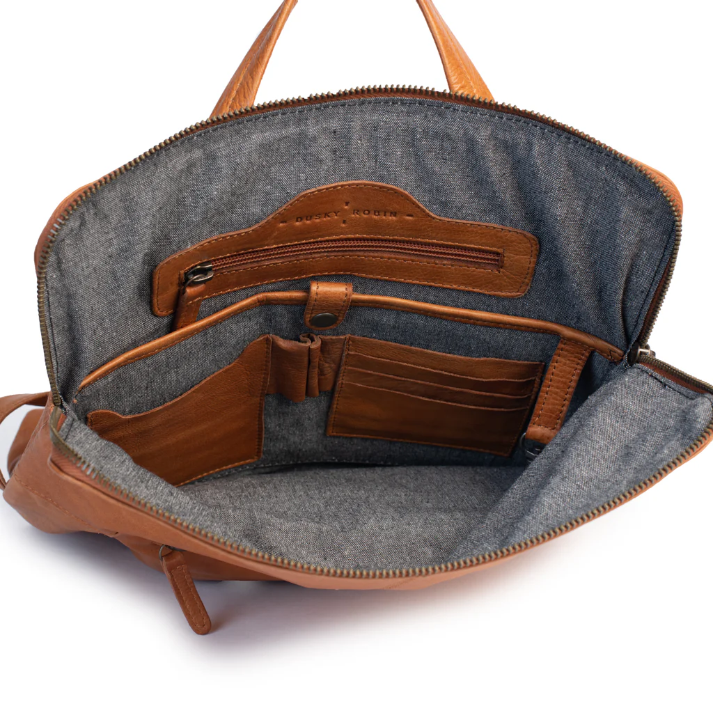 Inside view of Brooklyn Backpack featuring leather pockets and internal organizer for essentials.