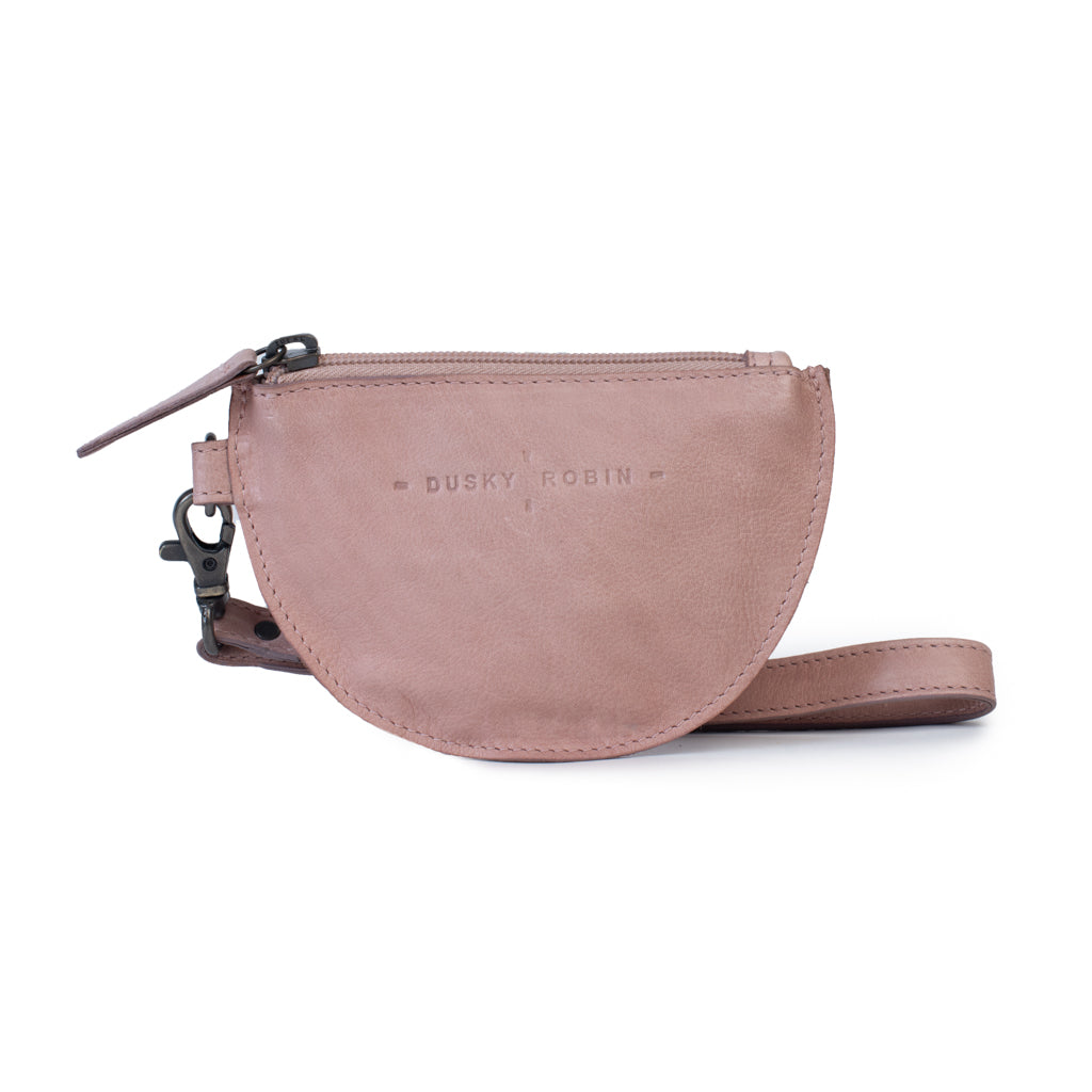 Dusty pink leather coin purse with wrist strap and zip closure, perfect for coins and essentials.