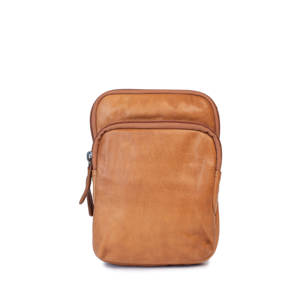 Sophie Bag in soft leather, featuring a minimalist design with zip closure and adjustable crossbody strap.