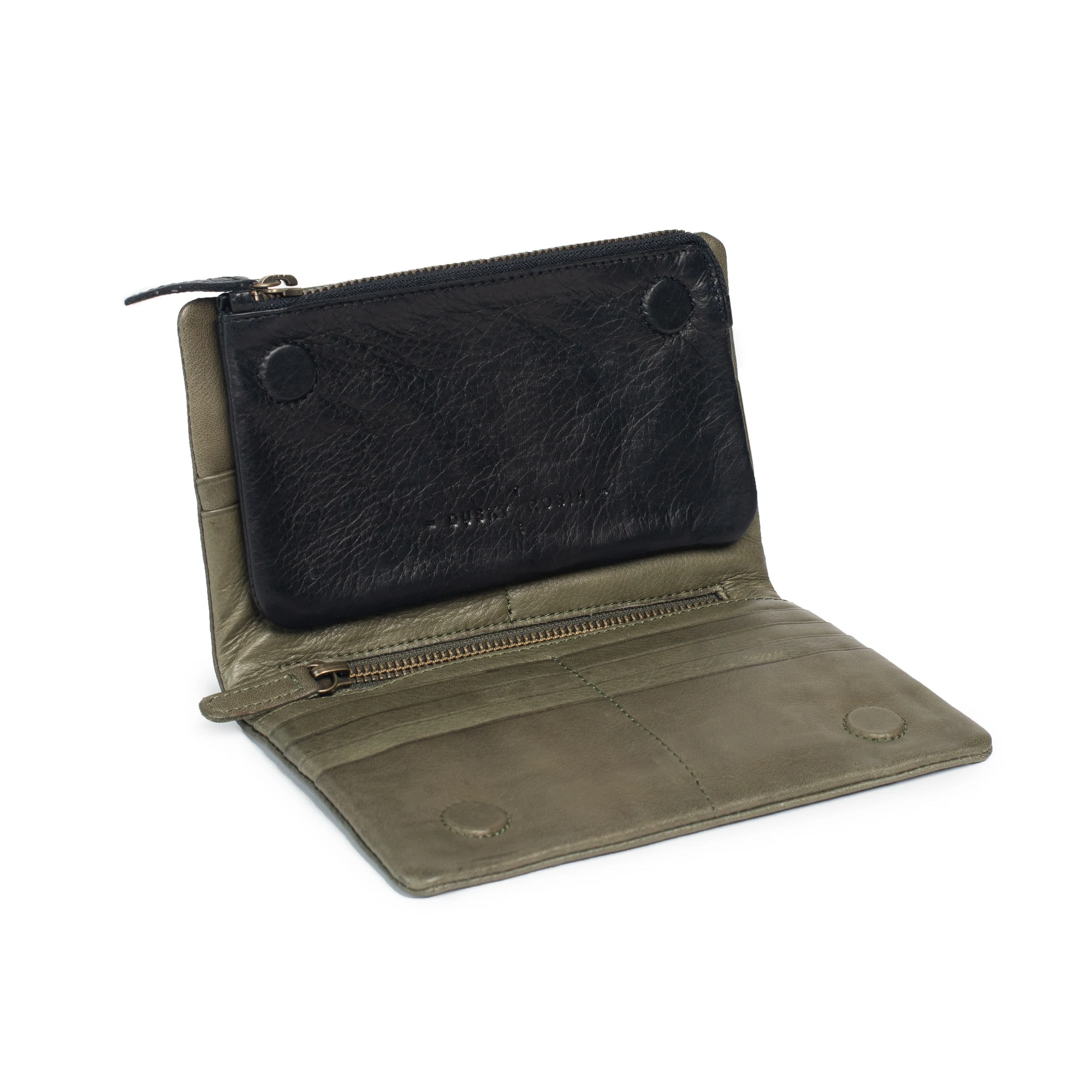 Open leather purse featuring removable magnetic insert, multiple card slots, and zippered section, in dark grey chambray lining.